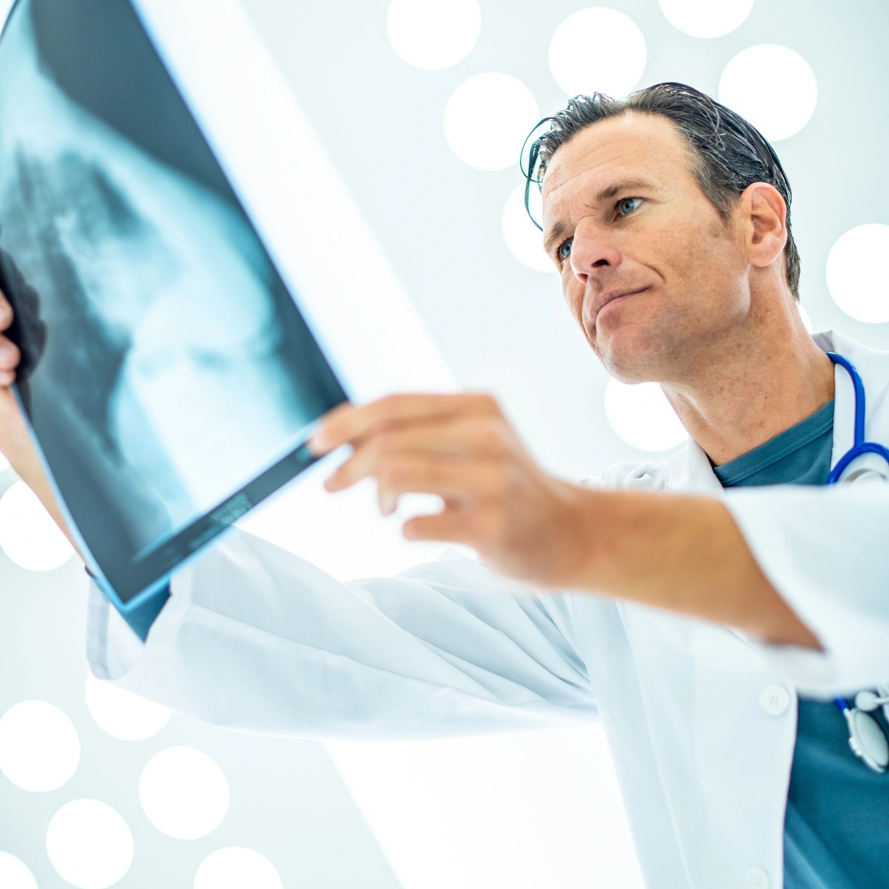 Medical clinician reviewing diagnostic information