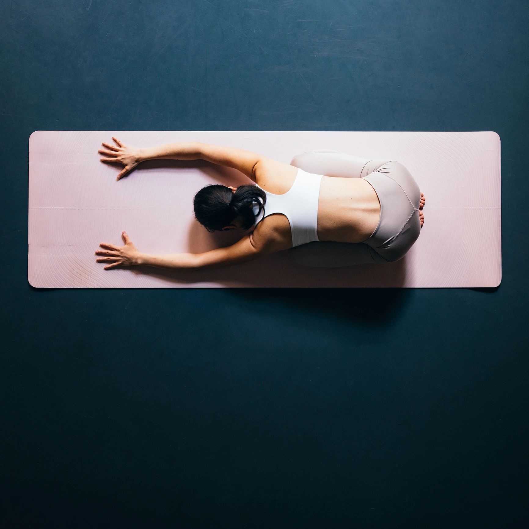 Woman stretching as part of an active wellness routine