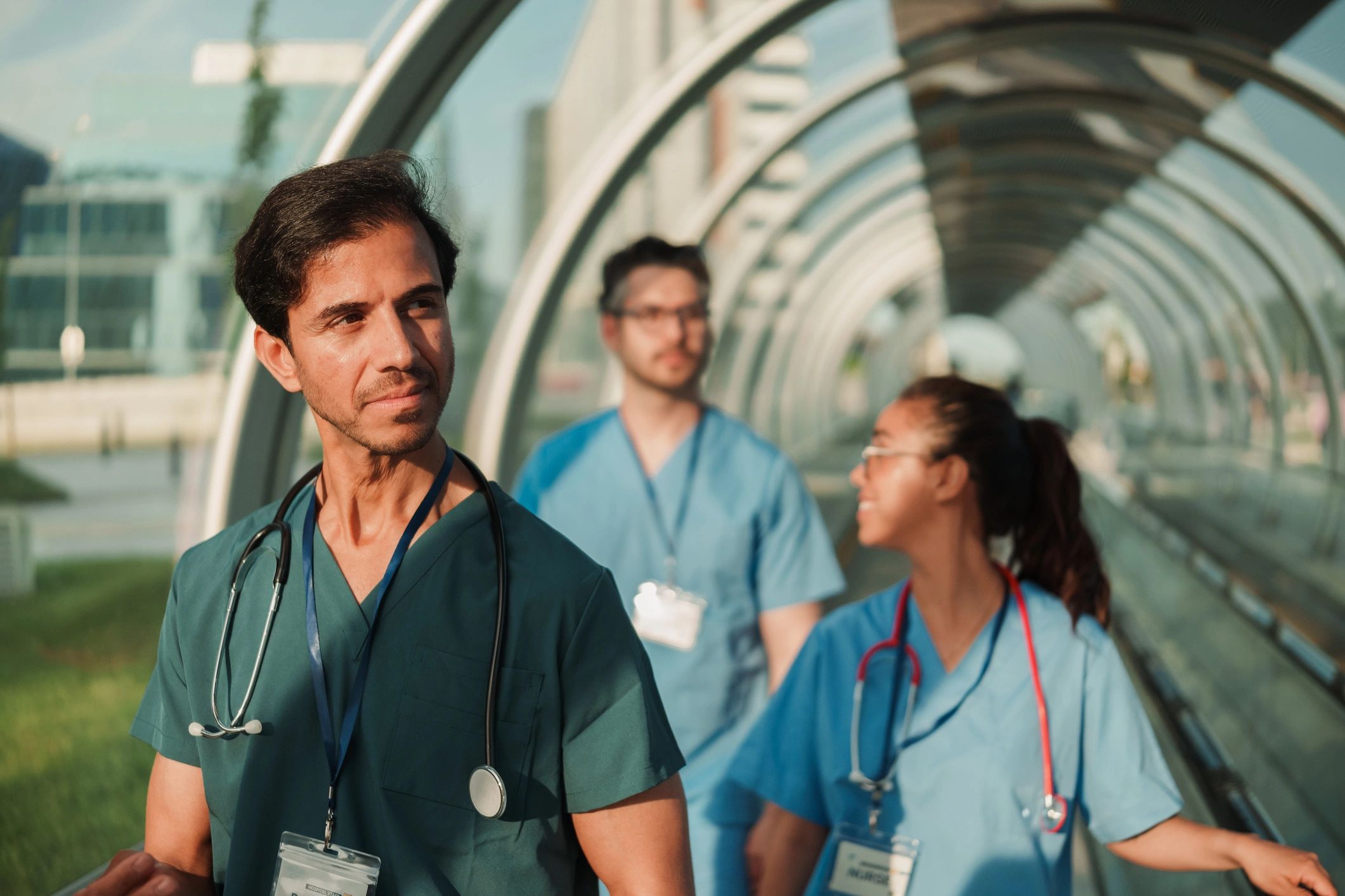 Collaborative medical wellness team walking through a modern clinic